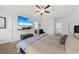 Spacious main bedroom with TV, ceiling fan, vaulted ceilings, and large windows at 9652 Spencer Woods Rd, Ladson, SC 29456