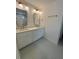 Elegant bathroom features double sinks, marble countertops, modern fixtures, and decorative mirrors at 971 Beehive Rd, Awendaw, SC 29429