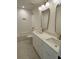 Elegant bathroom with dual vanities, marble countertops, modern fixtures, and stylish mirrors at 971 Beehive Rd, Awendaw, SC 29429