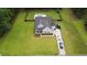 Spacious backyard with a private pool, surrounded by lush greenery and a wooden fence at 1010 Deep Gap Rd, Ridgeville, SC 29472