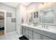 Bright bathroom with a double vanity, stylish fixtures, and elegant tile flooring at 1010 Deep Gap Rd, Ridgeville, SC 29472