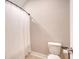 Bathroom with a white toilet and a shower featuring a simple shower curtain at 1010 Deep Gap Rd, Ridgeville, SC 29472