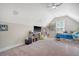 Cozy bedroom featuring neutral walls, carpet flooring, shelving, a ceiling fan, and a comfortable bed with storage at 1010 Deep Gap Rd, Ridgeville, SC 29472