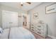 This bedroom features neutral walls, carpet, a ceiling fan, bright windows, and comfortable furniture, exuding a relaxing atmosphere at 1010 Deep Gap Rd, Ridgeville, SC 29472