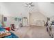 Neutral bedroom with carpet features a ceiling fan, neutral walls, dressers, and decor, exuding a comfortable ambiance at 1010 Deep Gap Rd, Ridgeville, SC 29472