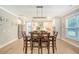 Inviting dining room showcasing modern lighting and seamlessly connected to the open-concept kitchen at 1010 Deep Gap Rd, Ridgeville, SC 29472
