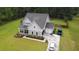 Well-maintained two-story home featuring an attached garage and a beautifully landscaped front yard at 1010 Deep Gap Rd, Ridgeville, SC 29472