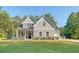 Charming home with manicured front yard, a covered porch, and a well-kept lawn at 1010 Deep Gap Rd, Ridgeville, SC 29472