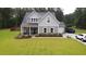 Charming two-story home with manicured lawn, covered porch, and attached garage at 1010 Deep Gap Rd, Ridgeville, SC 29472