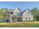 Charming two-story home with a covered front porch and manicured lawn at 1010 Deep Gap Rd, Ridgeville, SC 29472