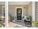 Welcoming front porch decorated with seasonal decor and rocking chairs at 1010 Deep Gap Rd, Ridgeville, SC 29472