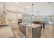 Modern kitchen featuring a center island, stainless steel appliances, and tile backsplash at 1010 Deep Gap Rd, Ridgeville, SC 29472