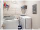 Functional laundry room with modern washer and dryer, shelving, and stylish decor at 1010 Deep Gap Rd, Ridgeville, SC 29472
