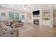 Cozy living room with a fireplace, ceiling fan, and access to the backyard at 1010 Deep Gap Rd, Ridgeville, SC 29472