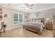 Serene primary bedroom with a large window and wooden furniture at 1010 Deep Gap Rd, Ridgeville, SC 29472