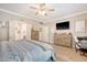 Spacious main bedroom with hardwood floors, elegant furnishings, ceiling fan, and natural light at 1010 Deep Gap Rd, Ridgeville, SC 29472