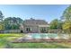 Backyard pool with patio area and lush landscaping, enclosed by a fence and mature trees at 1010 Deep Gap Rd, Ridgeville, SC 29472