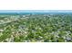 A high aerial shot capturing the community's homes, tree cover, proximity to the city, and the nearby waterway at 1011 Ashley Ave, Charleston, SC 29403