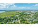 Scenic aerial view featuring lush green landscapes, a winding highway, and a cityscape under a bright, cloudy sky at 1011 Ashley Ave, Charleston, SC 29403