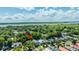 Aerial shot highlighting a residential area surrounded by lush greenery and a large body of water, arrow pointing to property at 1011 Ashley Ave, Charleston, SC 29403