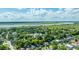 High-angle view of a suburban area with tree-lined streets, near the marshlands and river at 1011 Ashley Ave, Charleston, SC 29403