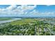 Beautiful aerial view with a river, wetlands, highway, and residential area under a partly cloudy sky at 1011 Ashley Ave, Charleston, SC 29403