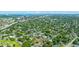 Overhead image showing a community near the city and bridge, surrounded by mature trees and well-kept residences at 1011 Ashley Ave, Charleston, SC 29403