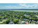 Scenic aerial shot showcases a vibrant neighborhood close to the water, framed by a lush landscape and a clear blue sky at 1011 Ashley Ave, Charleston, SC 29403