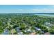 A broad aerial view showcases the neighborhood's dense tree cover and diverse housing styles at 1011 Ashley Ave, Charleston, SC 29403