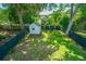 Private backyard with a storage shed, lush greenery, and plenty of space for outdoor activities at 1011 Ashley Ave, Charleston, SC 29403