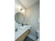 Modern half bath showcasing a stylish sink, fixtures, mirror, and decor at 1011 Ashley Ave, Charleston, SC 29403
