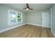 Unfurnished bedroom featuring hard wood floors and light-filled windows at 1011 Ashley Ave, Charleston, SC 29403