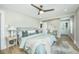 Bright, stylish bedroom with a ceiling fan, hardwood floors, and serene view to the home's entrance at 1011 Ashley Ave, Charleston, SC 29403