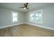 Bright bedroom featuring hard wood floors and light-filled windows at 1011 Ashley Ave, Charleston, SC 29403