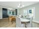 Bright dining room featuring hardwood floors, modern lighting, and open view to kitchen making it perfect for entertaining at 1011 Ashley Ave, Charleston, SC 29403