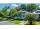 Charming two-story home with a welcoming front porch, beautiful landscaping, and flowering shrubbery at 1011 Ashley Ave, Charleston, SC 29403