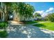 Charming home with a well-maintained lawn, driveway, and beautiful flowering trees in a serene setting at 1011 Ashley Ave, Charleston, SC 29403