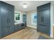 Kitchen featuring modern gray cabinetry, stainless appliances, with hardwood flooring at 1011 Ashley Ave, Charleston, SC 29403