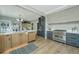 Spacious kitchen featuring a large island with modern appliances and hardwood floors throughout the room at 1011 Ashley Ave, Charleston, SC 29403