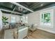 Sunlit living room with modern furnishings, hardwood floors, and custom ceiling details adding a touch of sophistication at 1011 Ashley Ave, Charleston, SC 29403
