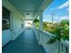 Inviting front porch with blue ceilings, plants, and views of the neighborhood at 1011 Ashley Ave, Charleston, SC 29403