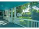 Inviting screened porch providing a view of the lush backyard with a storage shed at 1011 Ashley Ave, Charleston, SC 29403