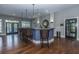 Stylish bar area with granite counters, wicker stools, and wood flooring at 1022 Basildon Rd, Mount Pleasant, SC 29466