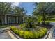 Inviting clubhouse entrance featuring colorful flowerbeds and manicured shrubs at 1022 Basildon Rd, Mount Pleasant, SC 29466
