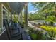 Relaxing clubhouse porch with rocking chairs and green potted plants at 1022 Basildon Rd, Mount Pleasant, SC 29466
