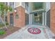 Close up of building entrance featuring compass design, brick and covered access to the building at 1022 Basildon Rd, Mount Pleasant, SC 29466