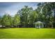 Lush green space features a charming gazebo, surrounded by mature trees for serene outdoor enjoyment at 1022 Basildon Rd, Mount Pleasant, SC 29466