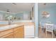 A well-lit kitchen featuring stainless steel appliances and light wood cabinets with adjacent dining area at 1022 Basildon Rd, Mount Pleasant, SC 29466