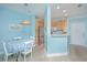 Bright, open kitchen/dining area with stainless appliances and blonde wood cabinetry; features an open floor plan at 1022 Basildon Rd, Mount Pleasant, SC 29466