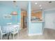 Bright, open kitchen/dining area with stainless appliances and blonde wood cabinetry; features an open floor plan at 1022 Basildon Rd, Mount Pleasant, SC 29466